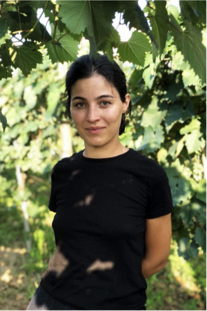 Baia Abuladze, one of the cofounders of Baia's Winery, standing in a vineyard