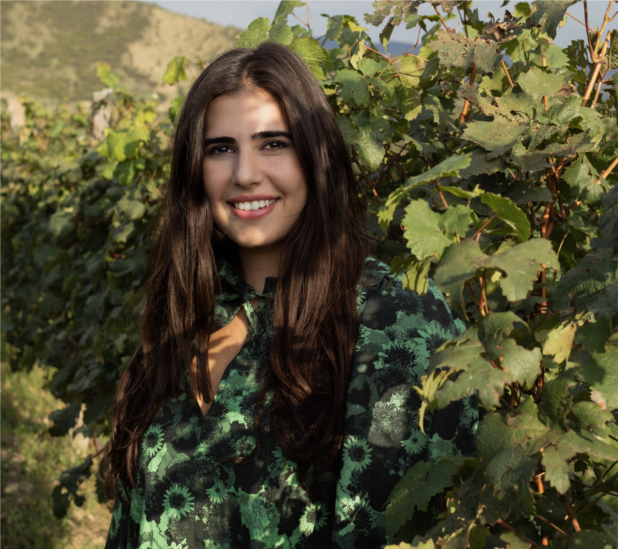 Maria Giuashvili, CEO of Giuaani, standing in a vineyard