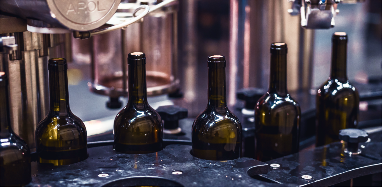 Wine bottles on a production line at Giuaani winery