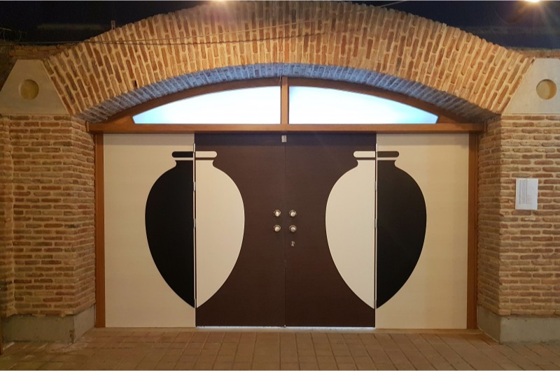 Entrance to Marani Winery with traditional wine vessel design on doors