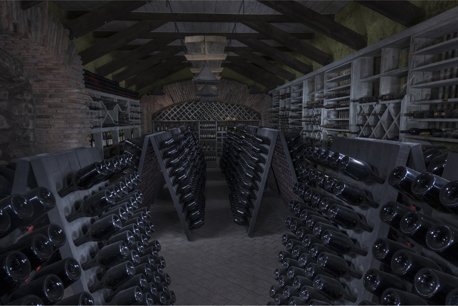 Cellar with wine bottles at Shumi winery