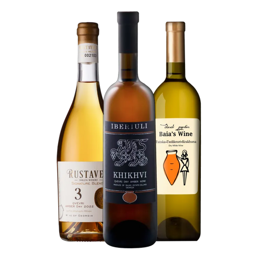 Three bottles of Georgian amber wine featuring Rustaveli 3 Qvevri, Iberiuli Khikhvi, and Tsitska, Tsolikouri, Krakhuna from Baia’s Wine.