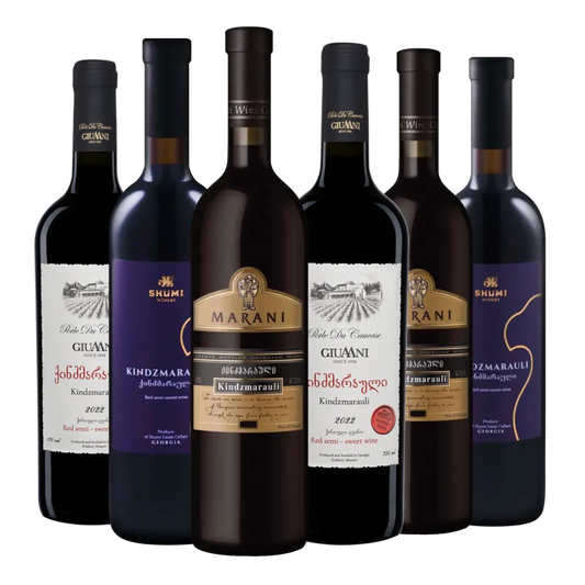 A collection of bottles of Kindzmarauli wine from Giuaani, Shumi and Marani wineries