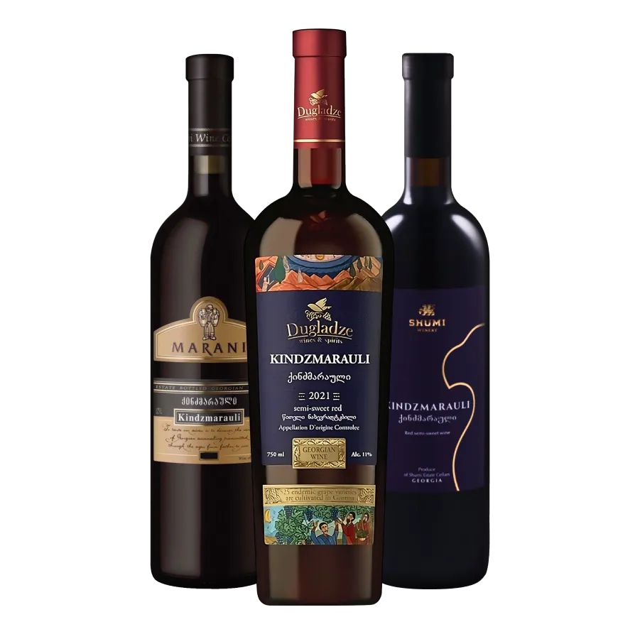 Three bottles of georgian semi-sweet red Kindzmarauli wine from Marani, Dugladze, and Shumi wineries.